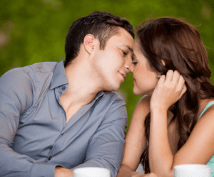 couple sitting and kissing Kiss on the First Date