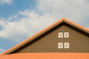 Free Orange and Gray Painted Roof Under Cloudy Stock Photo