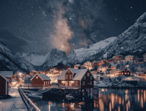 Night in a wintery landscape with red houses in the background.